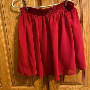 Red skater girl skirt. Sheer overlay with satin like slip. Near new.